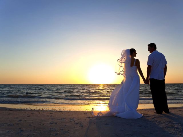 Married Couple Sunset Picture on the Beach